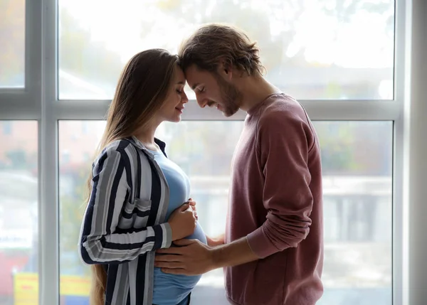 Young Pregnant Couple Window Home — Stock Photo, Image