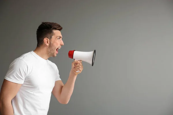 Screaming Young Man Megaphone Grey Background — Stock Photo, Image