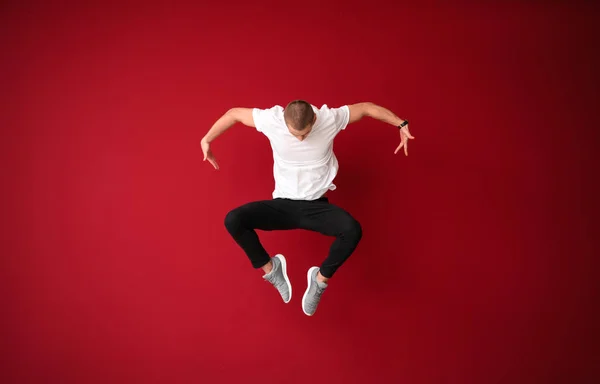 Young Male Dancer Jumping Color Background — Stock Photo, Image