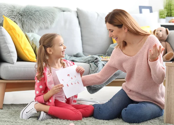 Little Daughter Showing Her Mother Picture Home — Stock Photo, Image