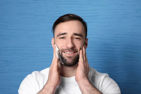 Handsome Man Applying Shaving Foam His Face Color Background — Stock Photo, Image