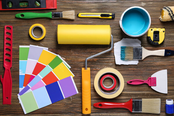 Items of professional painter on wooden background