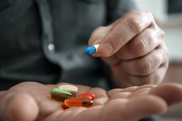 Mature Man Holding Different Pills Closeup — Stock Photo, Image