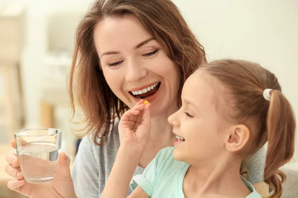 Little Daughter Giving Pill Her Mother Home — Stock Photo, Image