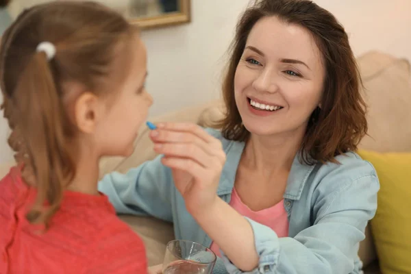 Young Woman Giving Pill Her Daughter Home — Stock Photo, Image