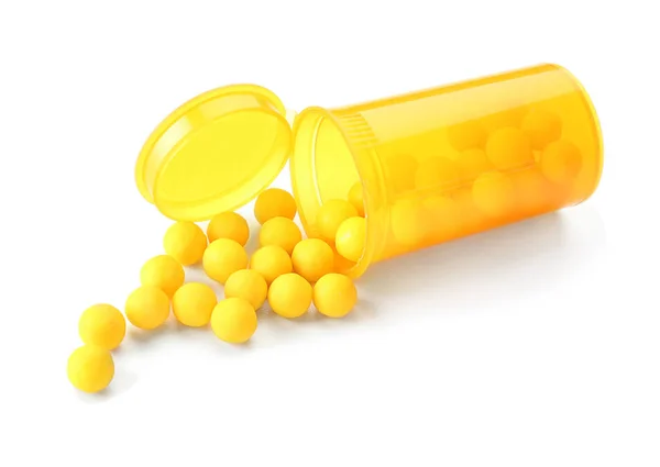 Behälter Mit Gelben Pillen Auf Weißem Hintergrund — Stockfoto