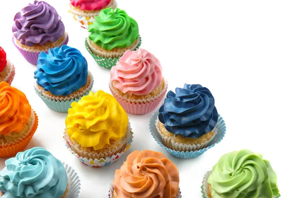 Colorful cupcakes on white background