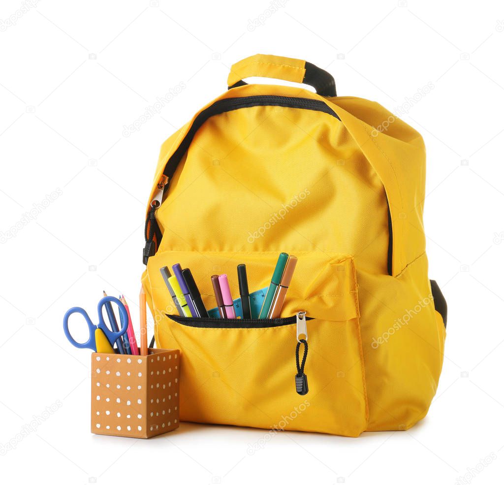 Backpack with school supplies on white background