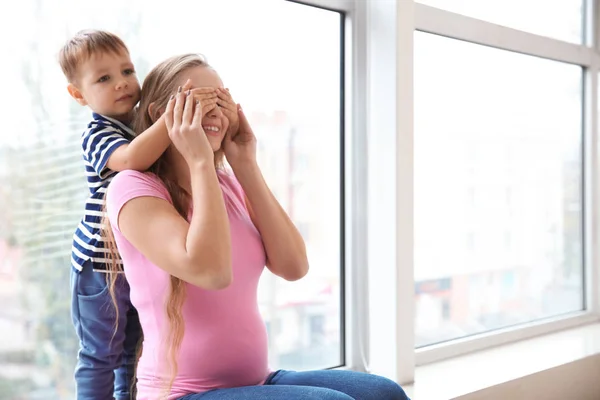 Young Pregnant Woman Playing Her Cute Little Son Window — Stock Photo, Image