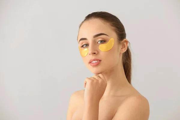 Beautiful Young Woman Eye Patches Light Background — Stock Photo, Image