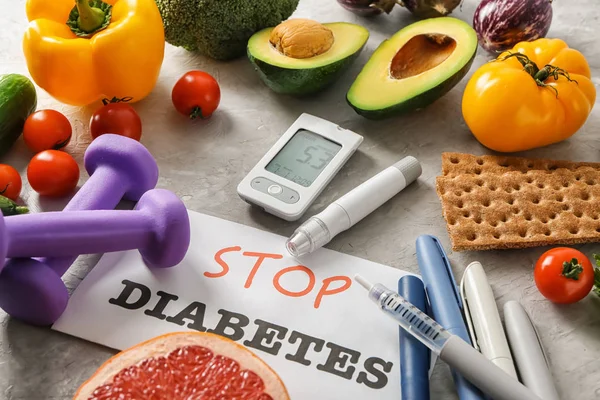 Composition with glucometer and healthy food on grey background. Diabetes diet