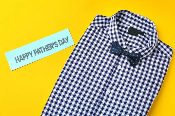 Male shirt on color background. Father\'s Day celebration