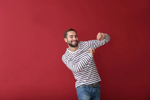 Guapo Joven Bailando Sobre Fondo Color —  Fotos de Stock