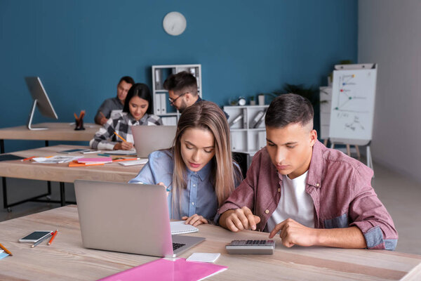 Young people studying with laptop at the university