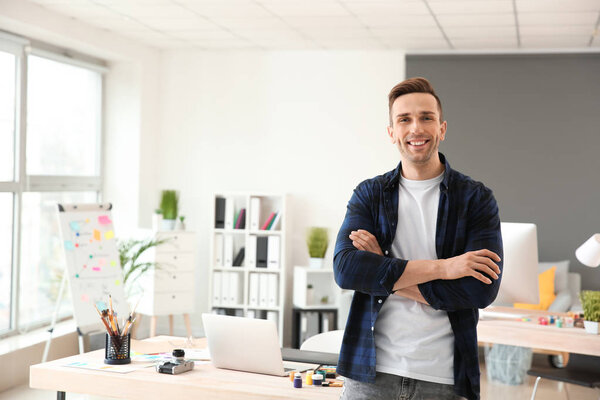 Portrait of young designer in office