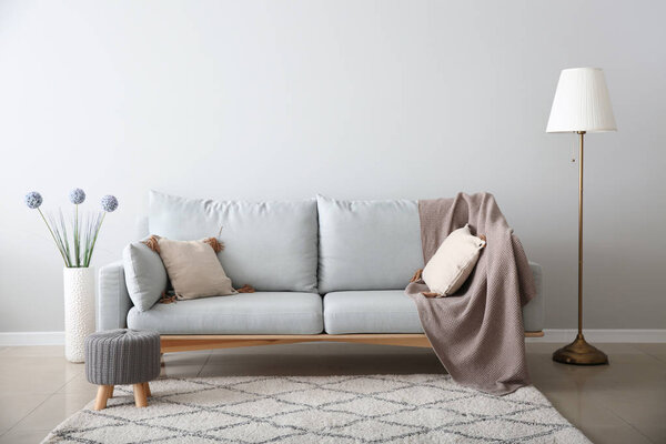 Soft sofa in interior of living room