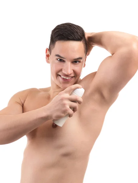 Hombre Joven Usando Desodorante Sobre Fondo Blanco — Foto de Stock