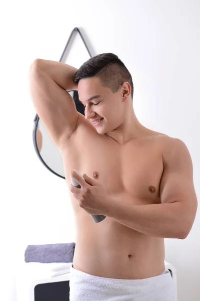 Young Man Using Deodorant Bathroom — Stock Photo, Image