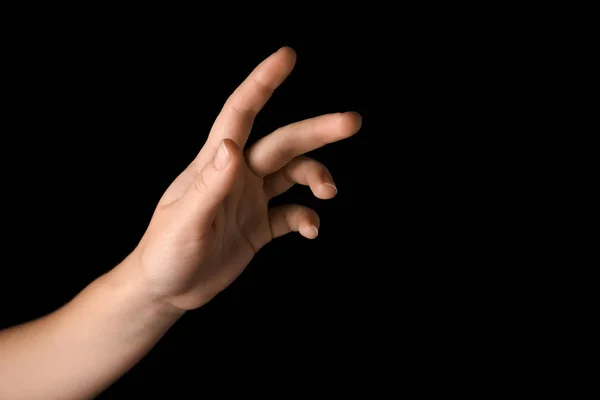 Weibliche Hand Auf Dunklem Hintergrund — Stockfoto