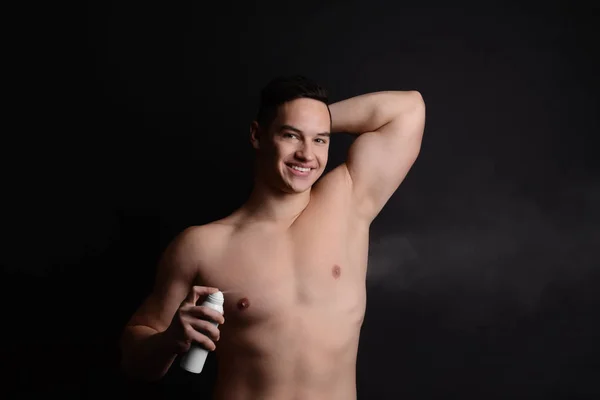 Young Man Deodorant Dark Background — Stock Photo, Image