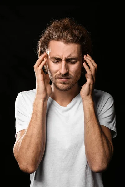 Young Man Suffering Headache Dark Background — Stock Photo, Image