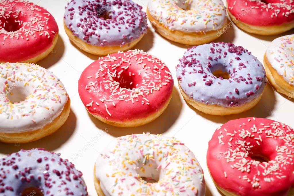 Tasty doughnuts on white background