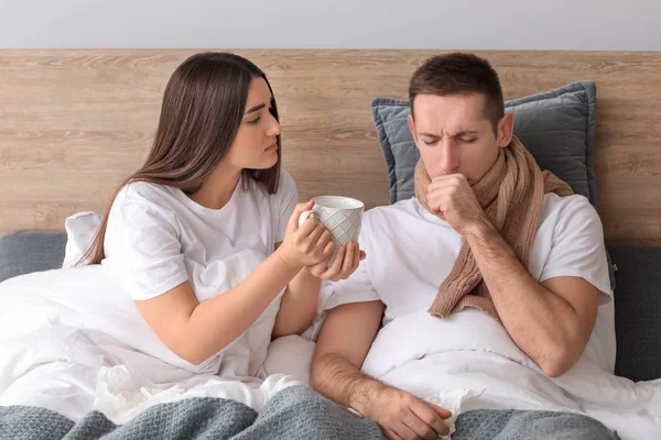 Woman Taking Care Her Husband Ill Flu Home — Stock Photo, Image