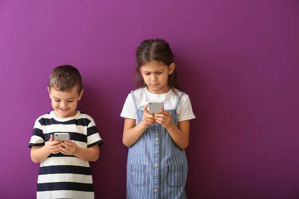 Cute Little Children Playing Smartphones Color Background — Stock Photo, Image