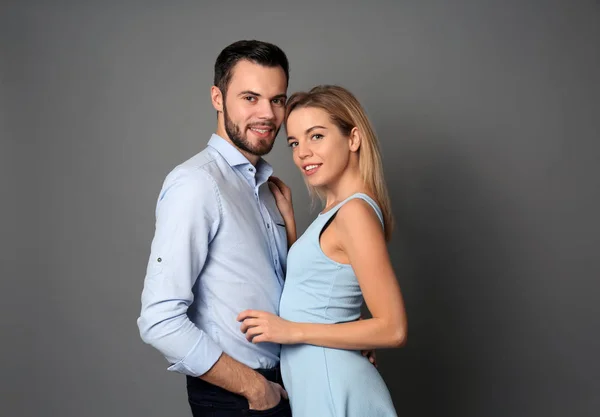 Stylish Young Couple Grey Background — Stock Photo, Image
