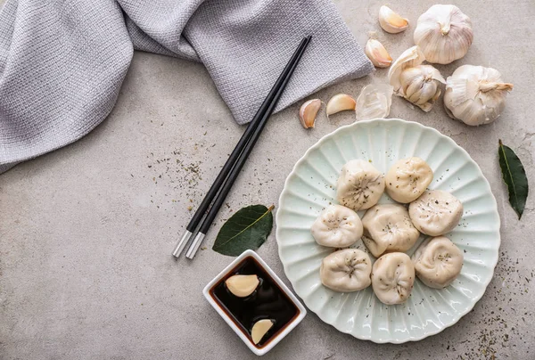 Composition with tasty Chinese dumplings on table