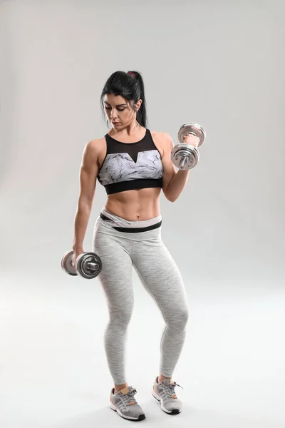 Sporty Muscular Woman Dumbbells Grey Background — Stock Photo, Image