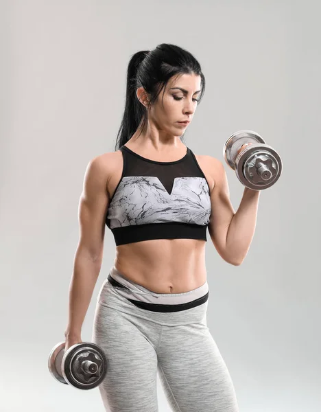 Sporty Muscular Woman Dumbbells Grey Background — Stock Photo, Image