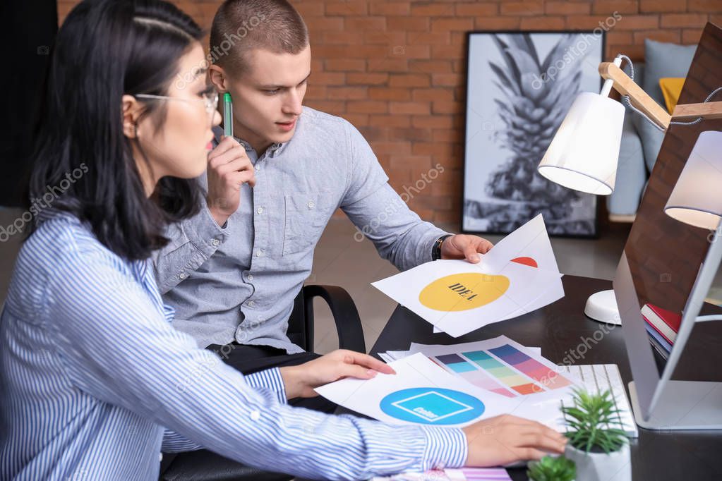 Designers working on new logo in office