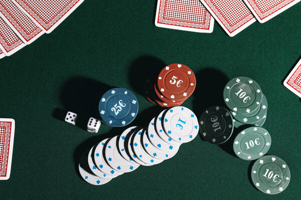 Chips and cards on table in casino