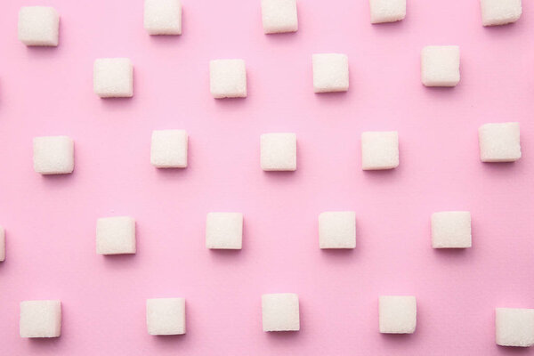 Many sugar cubes on color background