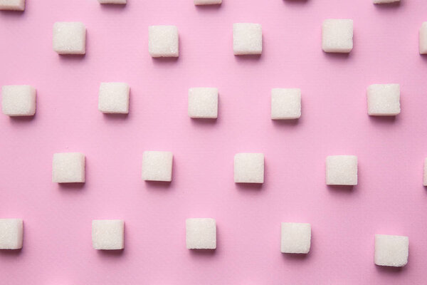 Many sugar cubes on color background