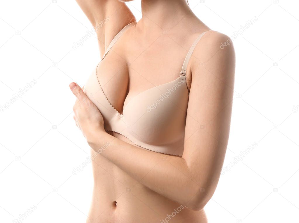 Young woman with beautiful breast on white background