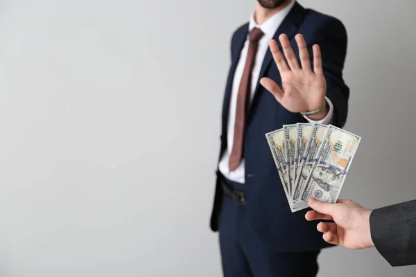 Businessman Refusing Take Bribe Light Background Concept Corruption — Stock Photo, Image