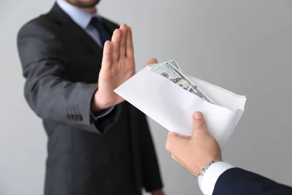 Businessman Refusing Take Bribe Light Background Concept Corruption — Stock Photo, Image