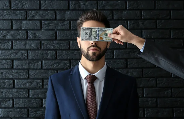 Man Bribe Covering Eyes Businessman Dark Brick Background Concept Corruption — Stock Photo, Image
