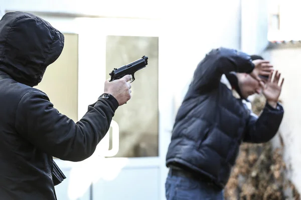 Armed Bandit Aiming Helpless Victim Outdoors — Stock Photo, Image