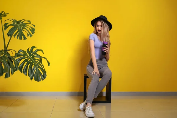 Fashionable Young Woman Sitting Color Wall — Stock Photo, Image