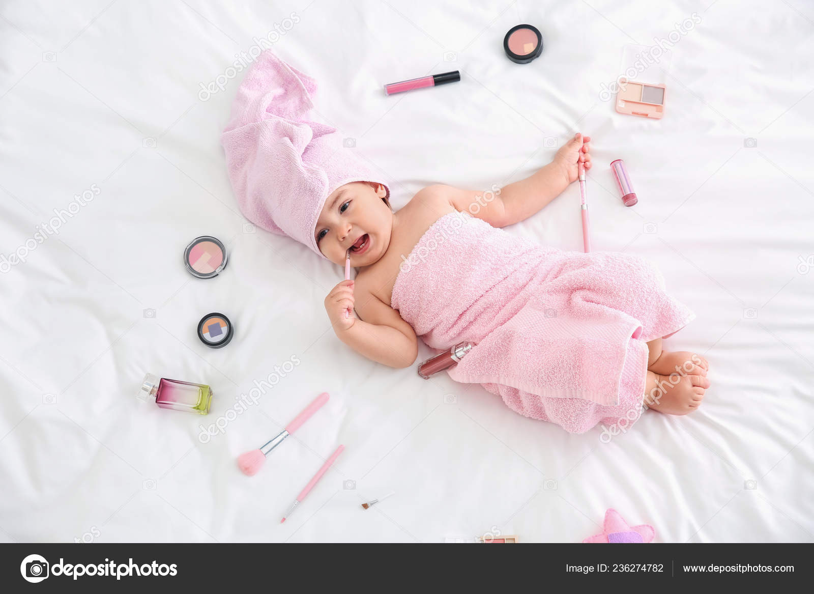 Cute Baby Girl Cosmetics Lying Bed Stock Photo by ©serezniy 236274782