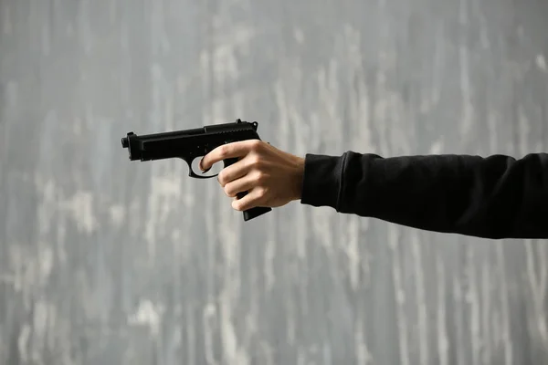 Male Criminal Gun Grey Background — Stock Photo, Image