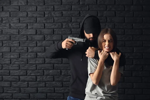 Male Criminal Scared Female Victim Dark Brick Background — Stock Photo, Image