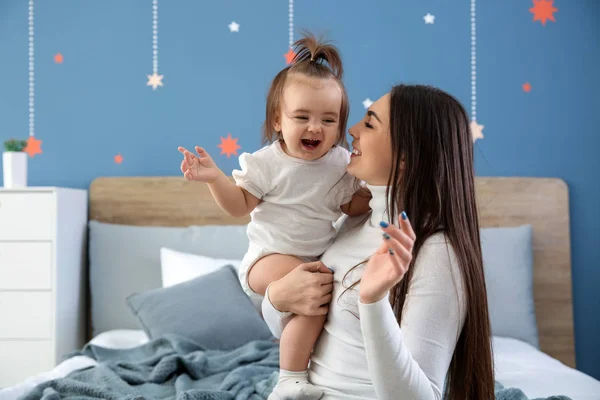 stock image Young mother with her cute little daughter at home