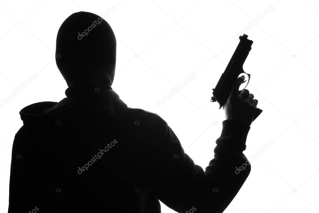Silhouette of bandit with gun on white background