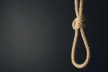 Koyu arka plan üzerinde ilmik ip. İntihar farkındalık kavramı