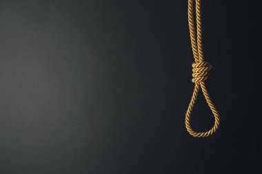 Koyu arka plan üzerinde ilmik ip. İntihar farkındalık kavramı