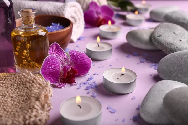 Beautiful Spa Composition Burning Candles Stones Color Background — Stock Photo, Image